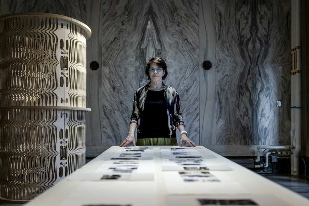 Professor Anne Munly in the Slocum Hall Marble Room gallery space