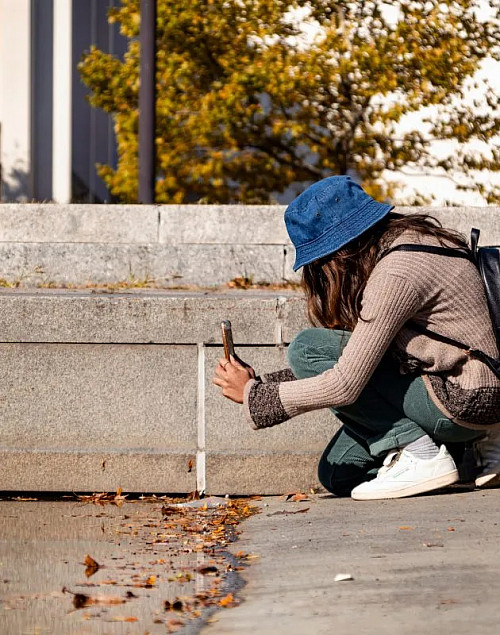 A first-year architecture student observes the leading lines in a section of a downtown park.