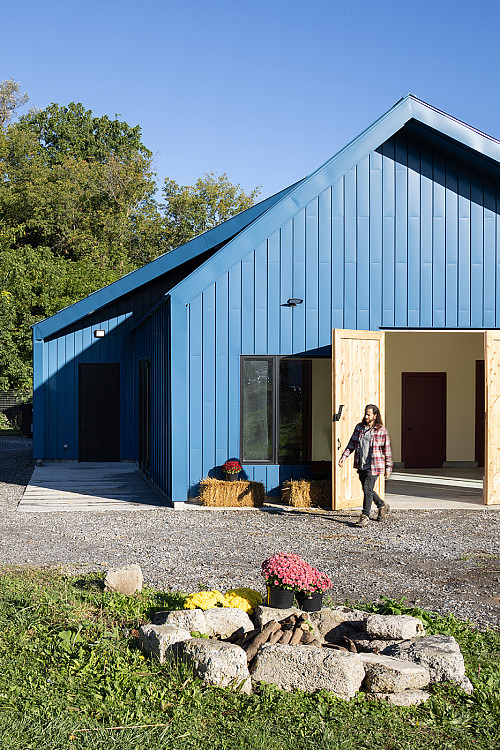 Oversize barn doors invite visitors in to the new, dedicated community space where Brady Farm provides educational opportunities, workfor...